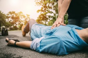 man on ground receiving cpr